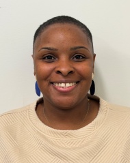 Ms. Drayton-Crumblin in front of a white background.