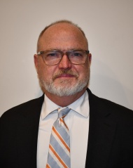 Mr. Michael Williams in front of a white background