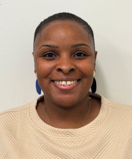 Ms. Drayton-Crumblin in front of a white background.