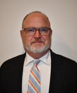 Mr. Michael Williams in front of a white background